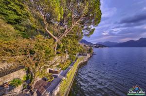 an aerial view of a body of water with trees at Villa Scoglio with Private Hot Tub and Air Conditioning in Lierna