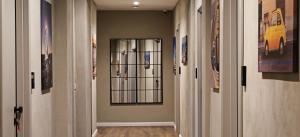 a hallway with two doors with a window in it at Sette Vele Rooms in Trieste
