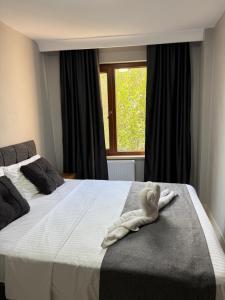 Ένα ή περισσότερα κρεβάτια σε δωμάτιο στο Rumeli Pansiyon