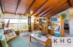 a living room with a couch and a table at Anti-Pera Cottage with private pool in Dilinata village! in Argostoli