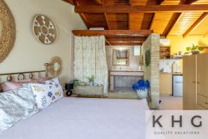 a bedroom with a bed and a kitchen at Anti-Pera Cottage with private pool in Dilinata village! in Argostoli +43 photos