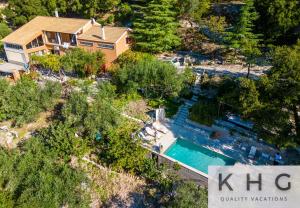 an aerial view of a house with a swimming pool at Anti-Pera Cottage with private pool in Dilinata village! in Argostoli