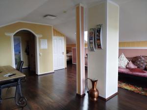 a living room with a couch and a table at Haus am Aartalsee in Bischoffen +63 photos