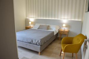 Ένα ή περισσότερα κρεβάτια σε δωμάτιο στο Lux Matera