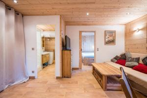 TV a/nebo společenská místnost v ubytování Montjoie Appt centr pied des pistes