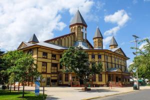 a large building with two towers on top of it at 3BR Beautiful Remodeled Victorian w/ Beach Locker in Ocean Grove