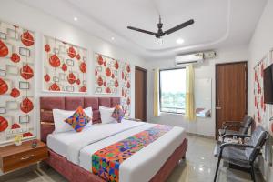 Ένα ή περισσότερα κρεβάτια σε δωμάτιο στο FabHotel AB Residency