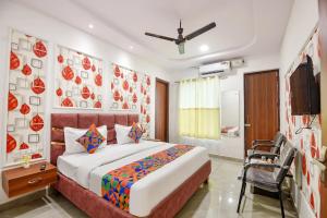 a bedroom with a bed and a television in it at FabHotel AB Residency in Ludhiana