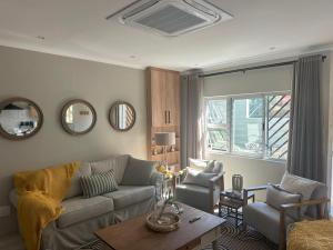 a living room with a couch and a table at 20 At Jeanette in Ludwigsdorf