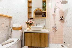a bathroom with a sink and a shower at Label6 To Ngoc Van - Crescendo Boutique Studio in Hanoi +63 photos