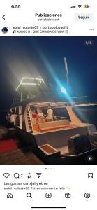 a page of a website with a boat on the water at Yate PORTOBELO LUXURY in Buenaventura