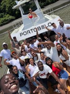 a group of people posing for a picture on a boat at Yate PORTOBELO LUXURY in Buenaventura