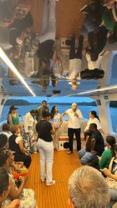 a group of people standing on a boat at Yate PORTOBELO LUXURY in Buenaventura