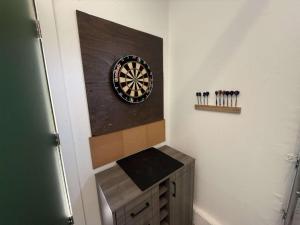 a dart board on a wall next to a dartboard at Stunning Cabin Rental for Glamping Escapes Between Bryce Canyon and Zion National Park in Long Valley Junction +22 photos