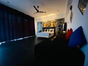 a bedroom with a bed in a room at Cloudora Inn Kandy in Kandy