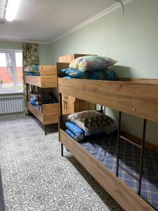 a room with two bunk beds in a room at Hostel House ЖК Ожет in Almaty