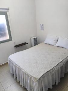 Ένα ή περισσότερα κρεβάτια σε δωμάτιο στο Aisha Alojamiento