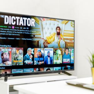 a flat screen tv sitting on top of a table at Modern Apartment - Wolverhampton Centre - Fast WiFi - Netflix 12AC in Wolverhampton