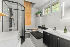 a bathroom with a shower and a sink at 200-Year-Old House By The Southern Archipelago in Mandal +31 photos