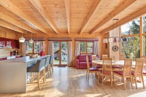 a kitchen and dining room with a table and chairs at Skiblickhaus in Russbach am Pass Gschütt
