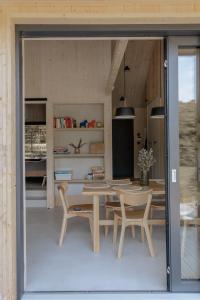 a dining room with a table and chairs at Wood Rest, MyWeek in Stronie Śląskie