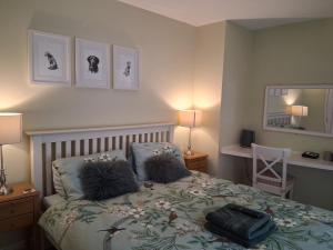 a bedroom with a bed with a bag on it at The Grove Arms 