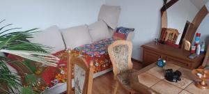 a living room with a couch and a table at Schweizerhaus Aue in Aue-Bad Schlema