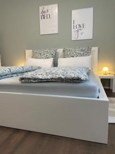 a white bed in a room with at Casa Antonius in Lebach