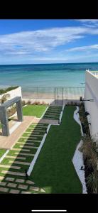a view of the ocean from a balcony of a beach at Maison Miralin Beach in Hammam Sousse