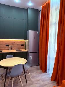 Η κουζίνα ή μικρή κουζίνα στο Квартира Арена Таурес