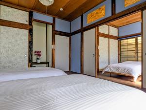 Postel nebo postele na pokoji v ubytování サマサマアイル saMa-saMa Aisle + 10 fotografií