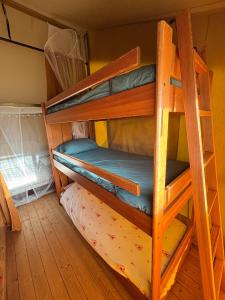 a bunk bed room with two bunk beds at Lodge La Forêt in Saint-Sauveur +21 photos