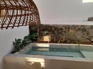 a swimming pool in the middle of a building at La Kaz Banian in Saint-Pierre