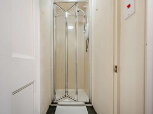 a walk in shower with a glass door in a bathroom at 4 Bed in Buttermere SZ090 in Buttermere