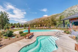 a swimming pool with a bench and a mountain at Million Dollar View- 419 in Rockwood
