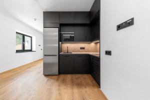 Η κουζίνα ή μικρή κουζίνα στο Rattendorf Luxury Apartments +21 φωτογραφίες