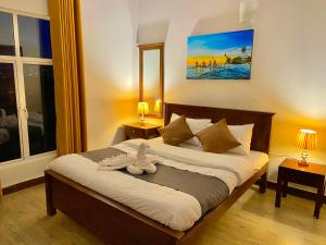 Postel nebo postele na pokoji v ubytování JETCO Lake Front Villa - Nuwara Eliya