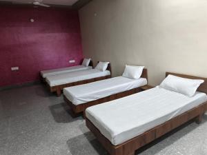 Postel nebo postele na pokoji v ubytování JD Bro Inn Hotel