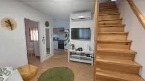 a staircase in a room with a living room at Ericeira TOP in Ericeira