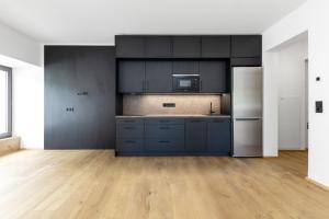 Η κουζίνα ή μικρή κουζίνα στο Rattendorf Luxury Apartments