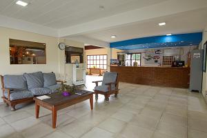 a living room with a couch and a table at Hostel Pioneros del Valle in El Chalten +20 photos