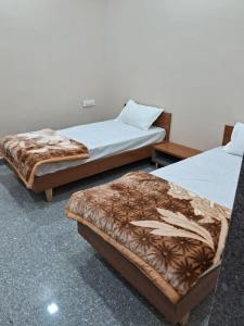 Postel nebo postele na pokoji v ubytování JD Bro Inn Hotel