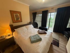 Postel nebo postele na pokoji v ubytování Welpie Guesthouse