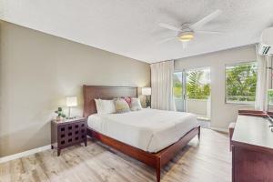 a bedroom with a bed and a ceiling fan at Plantation Hale D10 in Kapaa +31 photos