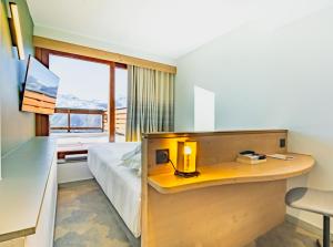 Ένα ή περισσότερα κρεβάτια σε δωμάτιο στο La Cachette, Friendly Hotel & Spa