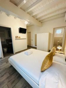 Postel nebo postele na pokoji v ubytování Giardini B&B + 25 fotografií