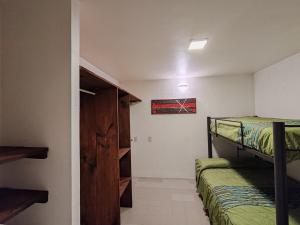 Ένα ή περισσότερα κρεβάτια σε δωμάτιο στο Casa Xico 424- Centro, Xicotepec, Puenlo Magico