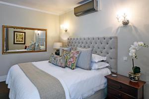 Ένα ή περισσότερα κρεβάτια σε δωμάτιο στο Le Petit Bijou Aparthotel