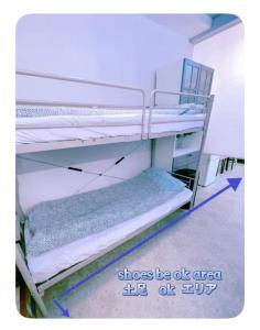 a couple of bunk beds in a room at 2 type room, Akira&chacha guest home杉並区世田谷direct to shinjuku for 13 min 上北沢4分 近涉谷新宿Suitable for three or more people in Tokyo +48 photos