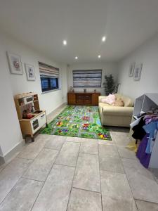 a living room with a couch and a rug at Kim's Place in Hingham